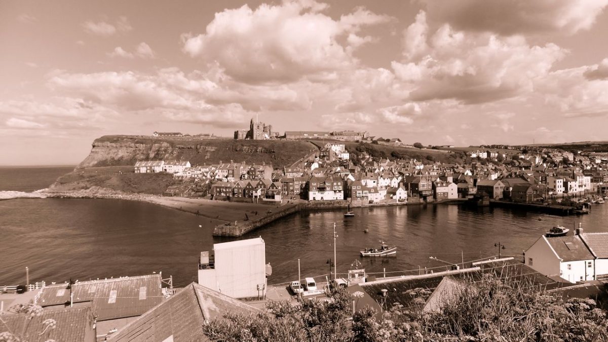 Whitby, North Yorkshire, UK - View looking towards Whitby Abbey and Tate Hill Beach + Tate Hill Pier